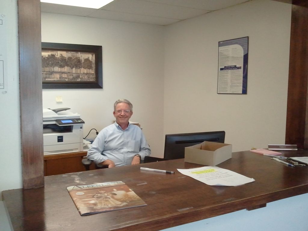 Brian Deneka wearing a light blue shirt.